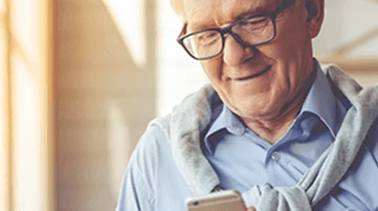 An elderly man on his phone
